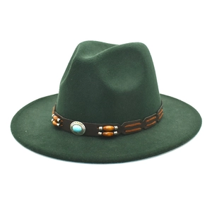 Detail of dark green fedora hat featuring a leather band with turquoise and wooden beads