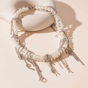 Multi-layer pearl necklace with silver moon and star charms and chain fringe tassels