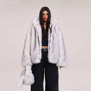 Oversized white faux fur hooded jacket with matching plush handbag and cargo pants