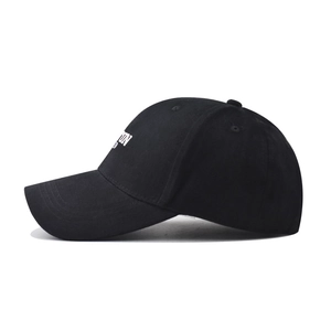 Detailed side view of a black cotton baseball cap with white Boston embroidery