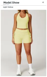 Detail of racerback yoga crop top and drawstring high waist gym shorts in sprout yellow