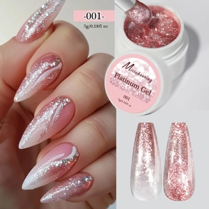 Macro detail of sparkling pink platinum nail gel showing texture and glitter on long nails