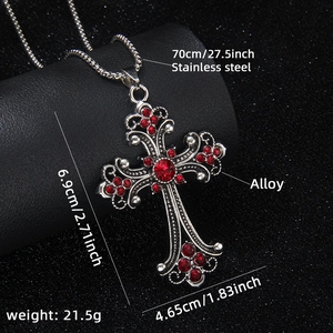 Hip hop stainless steel cross necklace with red crystals on a professional jewelry stand