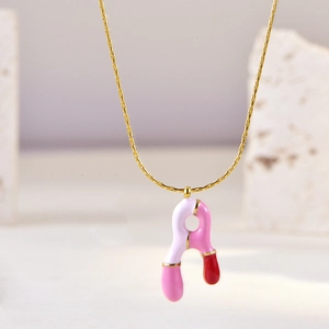 Pink and white enamel letter A pendant on a delicate gold chain necklace for women