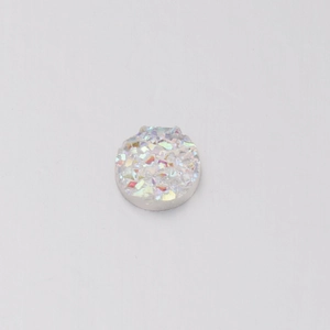 Macro detail of a 6mm white iridescent resin druzy bead with a textured sparkle finish