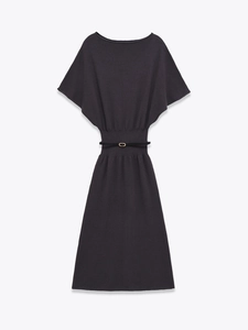 Detail of grey knitted midi dress featuring batwing sleeves and a thin black belt