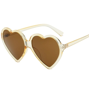 Champagne heart-shaped sunglasses with dark brown lenses and durable metal hinges