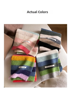 Detailed flat lay of rainbow striped mohair scarves with woven brand tags in four colorways