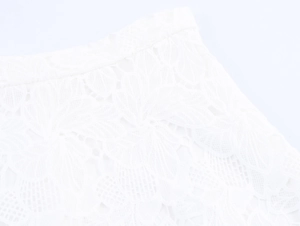Detailed close-up showing the intricate white lace floral hollow pattern and fabric texture