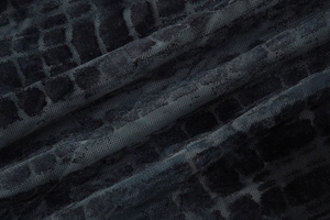 Macro shot of high-quality navy velvet fabric with textured grid pattern for short dress