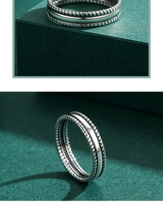 Close-up of vintage S925 sterling silver triple-layered ring with woven rope textures
