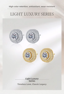 Close-up of hip-hop earrings with cubic zirconia pavé setting in gold and silver finish