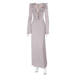 Detail of light pink long sleeve dress showing V-neckline and shimmering metallic fabric