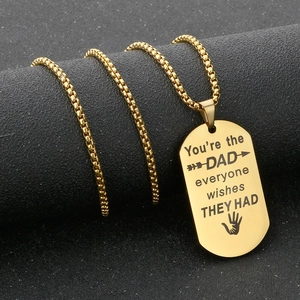 Detailed close-up of golden stainless steel dog tag necklace with laser engraved message for Dad