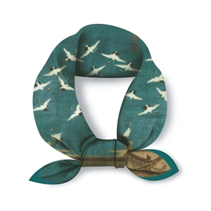 Detail of silk scarf showing a knotted teal fabric with traditional crane and landscape prints