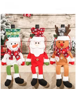 Detailed view of Christmas wine bottle covers featuring snowman, Santa, and elk plush motifs