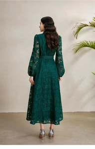 Back view of dark green lace dress with puffed lantern sleeves and a matching belt