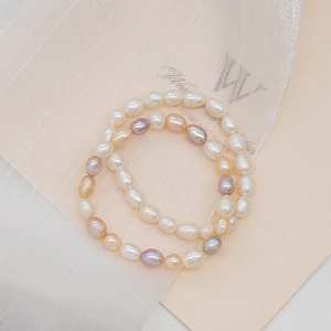 Mixed color freshwater baroque pearl bracelet with white pink and purple pearls on gauze