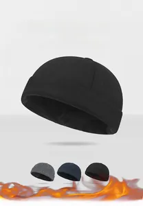 Close-up of wool docker hat in black, gray, and navy blue with ear protection feature