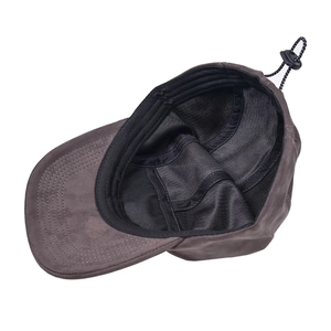 Detailed interior view of a brown suede baseball cap featuring adjustable toggle drawcord.