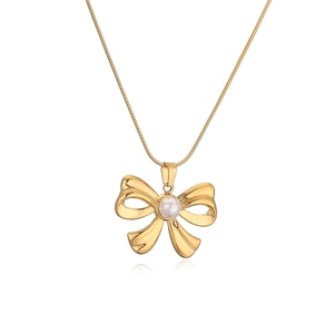 Elegant gold bow pendant necklace with a white pearl on a sleek snake chain for women
