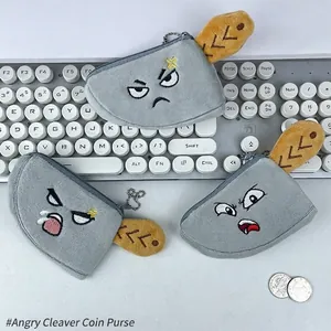 Funny cleaver shaped plush coin purse with expressive embroidery on white keyboard
