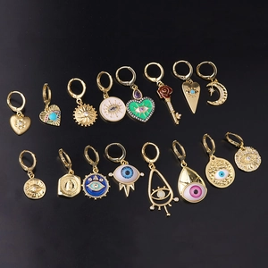Collection of golden bohemian evil eye and heart drop earrings with colorful enamel finish