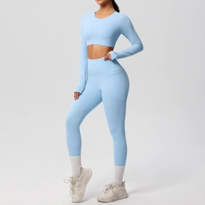 Detail of light blue yoga set featuring a functional side pocket on high-waist leggings