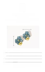 Detail view of 18K gold plated vintage bee earrings with baroque pearls and yellow enamel
