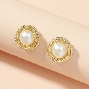 Elegant gold-tone button earrings with baroque pearls and twisted rope texture on pink stand