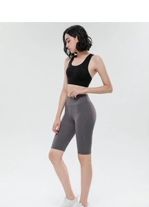 Detail view of high-waist yoga shorts with breathable fabric and side stitching seams