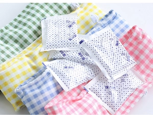 Detailed view of colorful plaid fabric pouches with cooling gel ice packs for pets