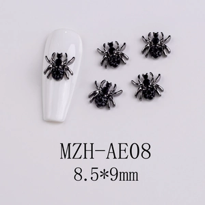 Macro detail of 8.5x9mm black spider nail art charms with rhinestones and alloy finish