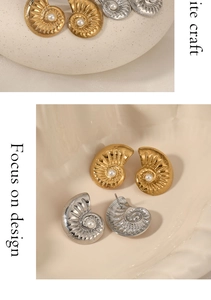 Macro view of French vintage conch earrings with sparkling diamonds and central pearls