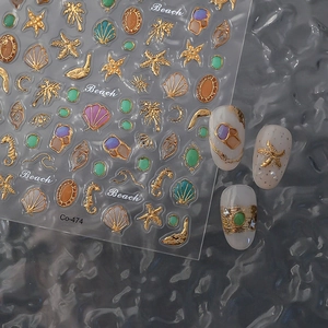 3D gold ocean nail stickers featuring shells, starfish, and seahorses on transparent sheets