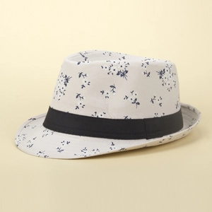 Close-up of floral sun hat with dark blue flower patterns and black decorative ribbon