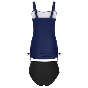 Detail of navy tankini top with white scalloped trim and adjustable side drawstring