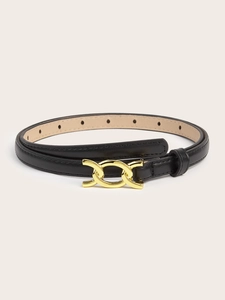 Detail of a slim black leather belt featuring a polished gold double ring metal buckle