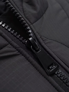 Detail view of durable black puffer jacket zipper with high-quality ripstop texture