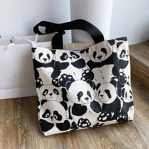 Close-up of cute panda print on large capacity canvas tote bag with black handles