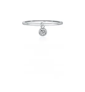 Detailed close-up of S925 sterling silver minimalist ring with tiny diamond pendant charm
