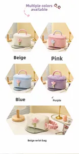 Quilted corduroy cosmetic bags with plush flower detail in multiple pastel colors