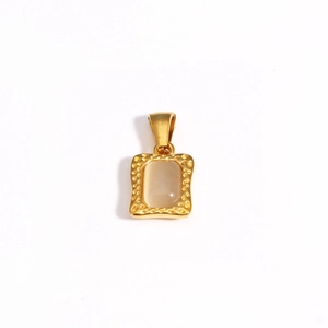 Detail of square gold pendant with hammer texture and light beige gemstone inlay