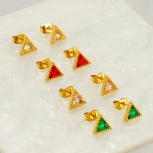 Detail of four pairs of triangular zircon stud earrings in various colors on marble