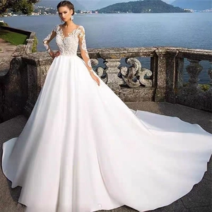Robe De Mariée Élégante À Manches Longues En Dentelle Brodée Avec Jupe En Satin Trapèze Et Longue Traîne Pour Mariée