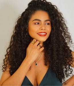 Close-up of model wearing 18K gold plated stainless steel necklace with black zircon pendant