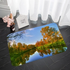 Detail of landscape flannel mat with autumn forest view on dark wood floor