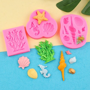 Pink silicone marine life mold set featuring seahorse, starfish, and coral for DIY cakes