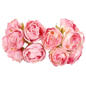 Macro view of multi-head artificial roses with pink gradient petals and silk texture