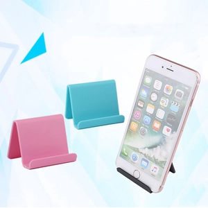 Soportes plegables universales para móvil en rosa, azul y negro con diseño triangular